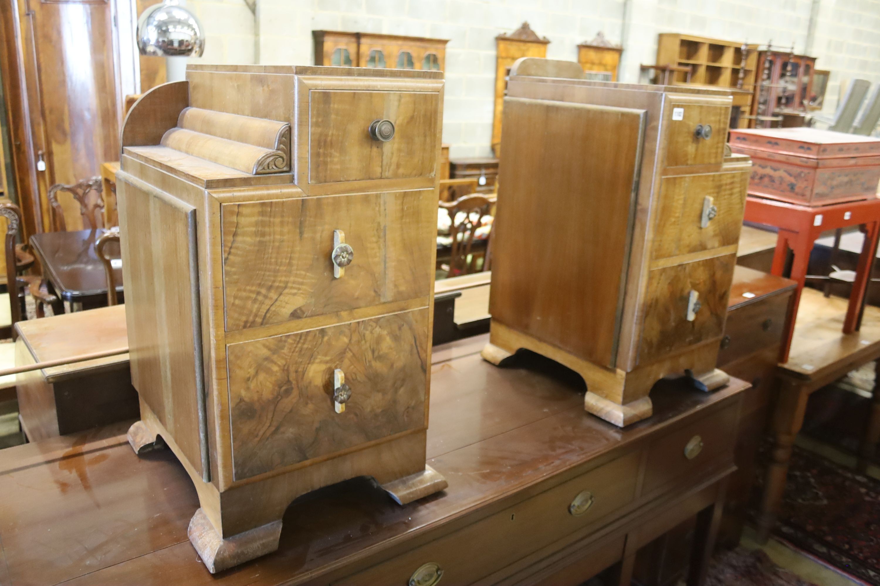 A pair of Art Deco style figured walnut bedside cabinets, width 40cm, depth 46cm, height 73cm